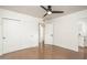 Neutral bedroom with a ceiling fan, closet with sliding doors, and ensuite bathroom entrance at 4729 N 24Th St, Phoenix, AZ 85016