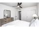 Clean bedroom featuring neutral tones and a large closet with a ceiling fan at 4729 N 24Th St, Phoenix, AZ 85016