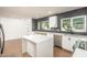 Bright kitchen featuring white countertops, stainless steel appliances, and a center island at 4729 N 24Th St, Phoenix, AZ 85016