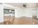 Open-concept living room featuring polished concrete floors, bright natural light, and a contemporary ceiling fan at 4729 N 24Th St, Phoenix, AZ 85016