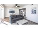 Inviting living room featuring a modern sofa, decorative artwork, a ceiling fan and lots of natural light at 4729 N 24Th St, Phoenix, AZ 85016