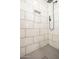 Shower stall featuring white tiled walls, a rain shower head, and a convenient built-in niche at 4729 N 24Th St, Phoenix, AZ 85016