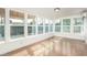 Bright sunroom with large windows overlooking the backyard and patio at 4729 N 24Th St, Phoenix, AZ 85016