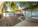 Hot tub with pergola in a well-maintained backyard with stepping stones at 4735 N 24Th St, Phoenix, AZ 85016