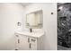 Modern bathroom with a walk-in shower and a bright vanity with undermount sink at 4735 N 24Th St, Phoenix, AZ 85016