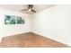 Bright bedroom with a ceiling fan and natural light from a window at 4735 N 24Th St, Phoenix, AZ 85016