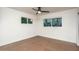 Well-lit bedroom with large windows, a ceiling fan, and neutral wall paint at 4735 N 24Th St, Phoenix, AZ 85016