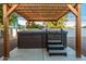 Hot tub with steps and pergola in a fenced yard at 4735 N 24Th St, Phoenix, AZ 85016
