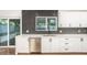 Bright kitchen features white cabinets, stainless steel appliances, and stylish herringbone backsplash at 4735 N 24Th St, Phoenix, AZ 85016