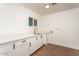 Clean laundry room with ample counter space, sink, and modern cabinets at 4735 N 24Th St, Phoenix, AZ 85016