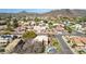 Expansive aerial showcases mountain views, residential streets, and desert landscaping at 4937 W Desert Hollow Dr, Phoenix, AZ 85083