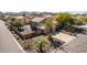 Aerial view of a lovely property with a pool, palm trees, and a driveway at 4937 W Desert Hollow Dr, Phoenix, AZ 85083