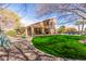 Spacious backyard with a lush lawn, pool and covered patio, perfect for entertaining at 4937 W Desert Hollow Dr, Phoenix, AZ 85083