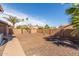Backyard featuring a concrete patio and desert landscaping with a block fence at 4937 W Desert Hollow Dr, Phoenix, AZ 85083