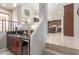 Stylish wet bar featuring modern cabinets, granite countertops, and an open view of the kitchen at 4937 W Desert Hollow Dr, Phoenix, AZ 85083