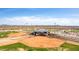 Aerial view highlights baseball fields with stadium seating, against the backdrop of the desert landscape at 4937 W Desert Hollow Dr, Phoenix, AZ 85083