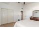Bright bedroom featuring carpet and a large closet with sliding doors at 4937 W Desert Hollow Dr, Phoenix, AZ 85083