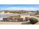 Entrance to The 500 Club featuring landscaped flower beds and a decorative stone wall at 4937 W Desert Hollow Dr, Phoenix, AZ 85083