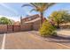 Exterior elevation of a lovely home featuring palm trees and desert landscaping at 4937 W Desert Hollow Dr, Phoenix, AZ 85083
