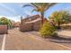 Exterior elevation of a lovely home featuring palm trees and desert landscaping at 4937 W Desert Hollow Dr, Phoenix, AZ 85083