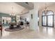 Grand foyer features soaring ceilings, decorative chandeliers, and a clear view into the adjacent living spaces at 4937 W Desert Hollow Dr, Phoenix, AZ 85083