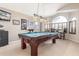 Spacious game room complete with a billiard table, ambient lighting, and sophisticated decor at 4937 W Desert Hollow Dr, Phoenix, AZ 85083