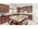Well-appointed kitchen with a large island, stainless steel appliances, and warm wood cabinetry at 4937 W Desert Hollow Dr, Phoenix, AZ 85083
