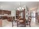 Spacious open-concept kitchen with a granite island, stainless steel appliances, and adjacent breakfast nook at 4937 W Desert Hollow Dr, Phoenix, AZ 85083