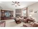 Comfortable living room with stone fireplace, plush leather seating, and large entertainment center at 4937 W Desert Hollow Dr, Phoenix, AZ 85083