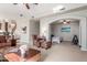 Bright living room showcasing fireplace, comfortable seating, and access to flex space at 4937 W Desert Hollow Dr, Phoenix, AZ 85083