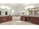 Large bathroom with double vanities, mirrors, soaking tub and plenty of natural light from multiple windows at 4937 W Desert Hollow Dr, Phoenix, AZ 85083