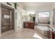 Expansive main bathroom with soaking tub, walk-in shower, and double sinks with granite counters at 4937 W Desert Hollow Dr, Phoenix, AZ 85083