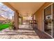 Outdoor covered patio features brick pavers, ceiling fan, bar seating and built-in barbeque at 4937 W Desert Hollow Dr, Phoenix, AZ 85083