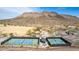 Community tennis courts, playground, and baseball field against a desert mountain backdrop in this outdoor recreation space at 4937 W Desert Hollow Dr, Phoenix, AZ 85083