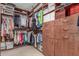 Organized walk-in closet with custom shelving and storage solutions for clothing and accessories at 4937 W Desert Hollow Dr, Phoenix, AZ 85083