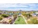 Beautiful aerial view of a waterpark that includes waterslides and a spacious lawn area with palm trees at 4937 W Desert Hollow Dr, Phoenix, AZ 85083