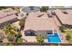 An aerial view of a home with a private pool, patio area, and lush landscaping within a fenced yard at 5225 S Opal Pl, Chandler, AZ 85249