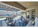 Beautiful patio has outdoor furniture, covered seating, and a TV for entertaining at 5225 S Opal Pl, Chandler, AZ 85249