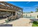 This backyard features a beautiful pool, covered patio, and outdoor dining at 5225 S Opal Pl, Chandler, AZ 85249