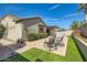 Landscaped backyard features an extended patio with pool and shaded pergola at 5225 S Opal Pl, Chandler, AZ 85249