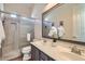 Modern bathroom features double sinks, a glass shower and neutral finishes at 5225 S Opal Pl, Chandler, AZ 85249