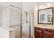 Bathroom features a glass-enclosed shower, vanity with stone countertops, and contemporary fixtures at 5225 S Opal Pl, Chandler, AZ 85249