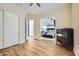 Open doorway to bedroom with shiplap wall and a large dresser with light wood floors at 5225 S Opal Pl, Chandler, AZ 85249