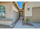 Inviting front entrance showcasing a covered walkway and a glimpse of the charming outdoor living space at 5225 S Opal Pl, Chandler, AZ 85249