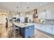 Modern kitchen with granite countertops, stainless steel appliances, and a stylish kitchen island at 5225 S Opal Pl, Chandler, AZ 85249