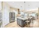 Bright kitchen with a center island, stainless appliances, and eat-in dining nook at 5225 S Opal Pl, Chandler, AZ 85249