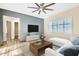Stylized living room with a cozy sofa, a flat screen TV, and contemporary decor at 5225 S Opal Pl, Chandler, AZ 85249