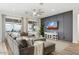 Relaxing living room offers a cozy sectional sofa, a large flat screen TV, and stylish decor at 5225 S Opal Pl, Chandler, AZ 85249