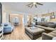 Open concept living room and kitchen featuring wood floors and comfortable seating at 5225 S Opal Pl, Chandler, AZ 85249