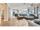 Spacious living room open to the kitchen, featuring modern furnishings and natural light at 5225 S Opal Pl, Chandler, AZ 85249